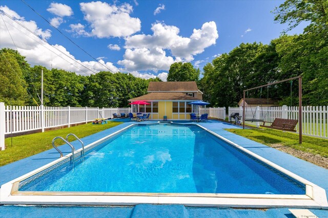 34 Pleasant St Unit 6, Plainfield, CT 06374 - view of pool featuring a storage structure, an outdoor structure, a patio, and view of scattered trees