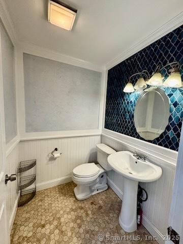 133 Main St Apt 4, Norwalk, CT 06851 - bathroom with crown molding and a wainscoted wall