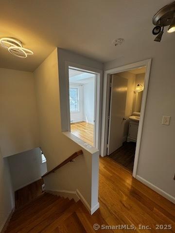 133 Main St Apt 4, Norwalk, CT 06851 - stairway with wood finished floors and baseboards