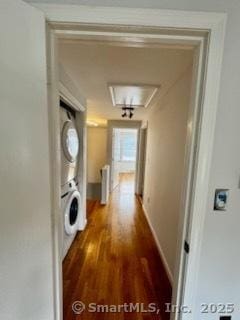 133 Main St Apt 4, Norwalk, CT 06851 - hall with stacked washer / drying machine, radiator, and wood finished floors