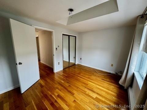 133 Main St Apt 4, Norwalk, CT 06851 - unfurnished bedroom featuring wood finished floors and a closet
