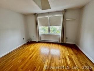 133 Main St Apt 4, Norwalk, CT 06851 - spare room featuring wood finished floors and baseboards