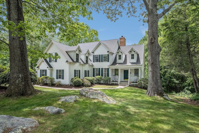 12 Stanton Ct, Madison, CT 06443 - view of front of property featuring a chimney, a porch, and a front yard