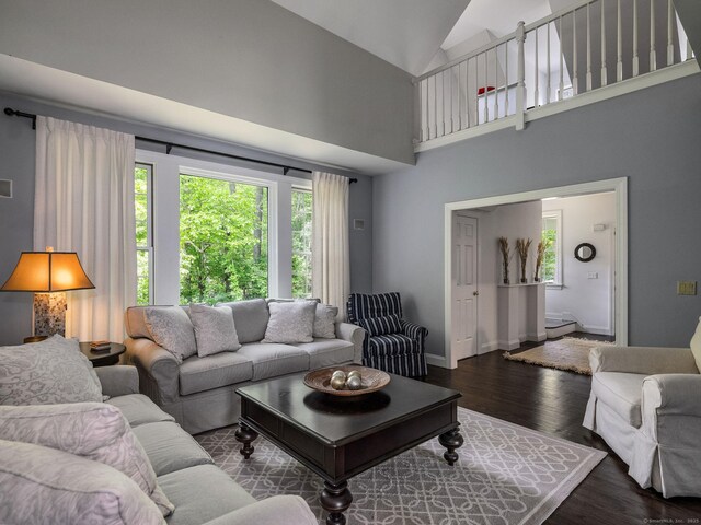 12 Stanton Ct, Madison, CT 06443 - living room with wood finished floors, high vaulted ceiling, and baseboards