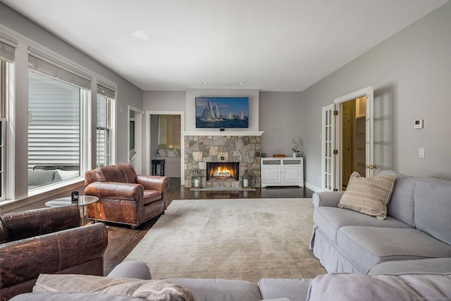 12 Stanton Ct, Madison, CT 06443 - living room featuring dark wood-type flooring and a stone fireplace