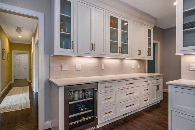 12 Stanton Ct, Madison, CT 06443 - bar featuring beverage cooler, decorative backsplash, baseboards, crown molding, and dark wood-style flooring
