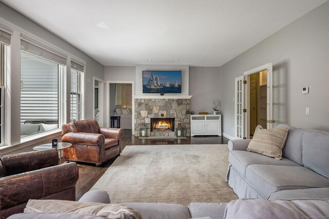 12 Stanton Ct, Madison, CT 06443 - living room with dark wood-type flooring and a stone fireplace