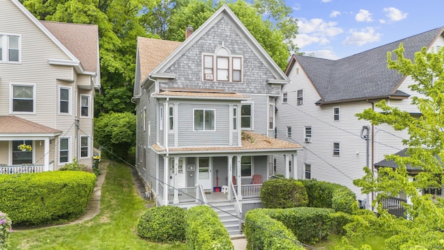 108 Highland Ave, Waterbury, CT 06708 - view of front facade featuring covered porch, a shingled roof, and a chimney