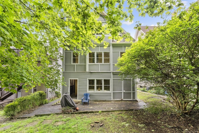 108 Highland Ave, Waterbury, CT 06708 - rear view of property with a sunroom