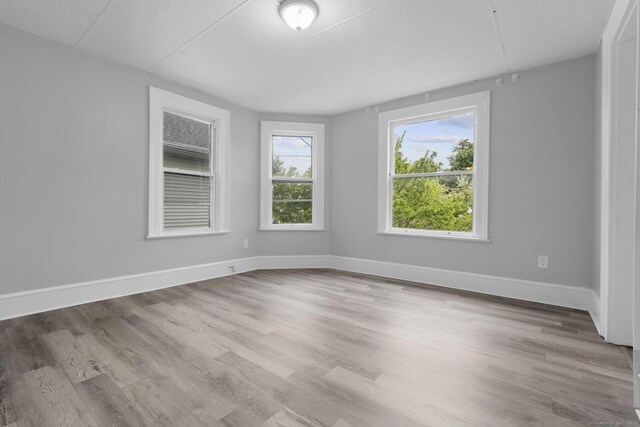 108 Highland Ave, Waterbury, CT 06708 - empty room with wood finished floors and baseboards