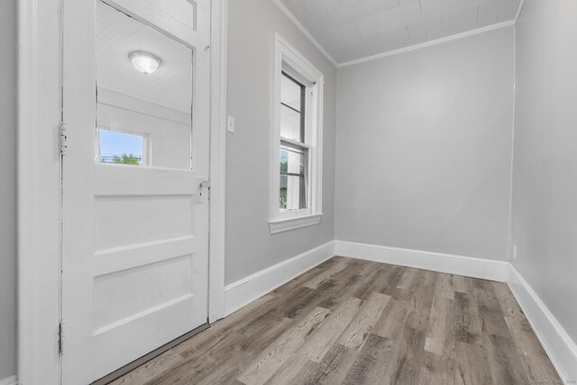 108 Highland Ave, Waterbury, CT 06708 - entryway featuring crown molding, wood finished floors, and baseboards