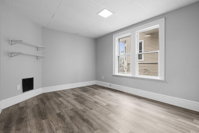108 Highland Ave, Waterbury, CT 06708 - unfurnished living room with wood finished floors and baseboards