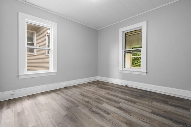 108 Highland Ave, Waterbury, CT 06708 - spare room with crown molding, dark wood-style floors, and baseboards