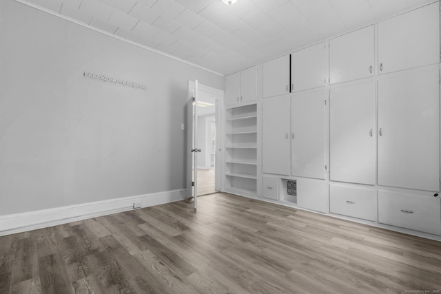 108 Highland Ave, Waterbury, CT 06708 - unfurnished bedroom featuring wood finished floors, baseboards, and crown molding