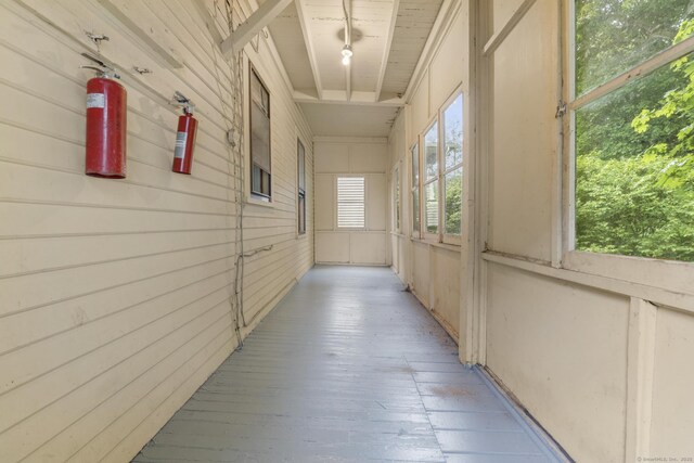 108 Highland Ave, Waterbury, CT 06708 - corridor featuring wooden walls and light wood-type flooring