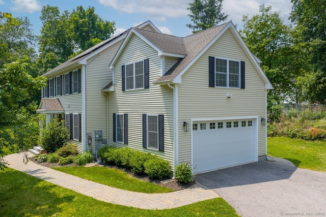 158 New London Rd, Groton, CT 06340 - view of home's exterior with driveway, roof with shingles, a lawn, and a garage