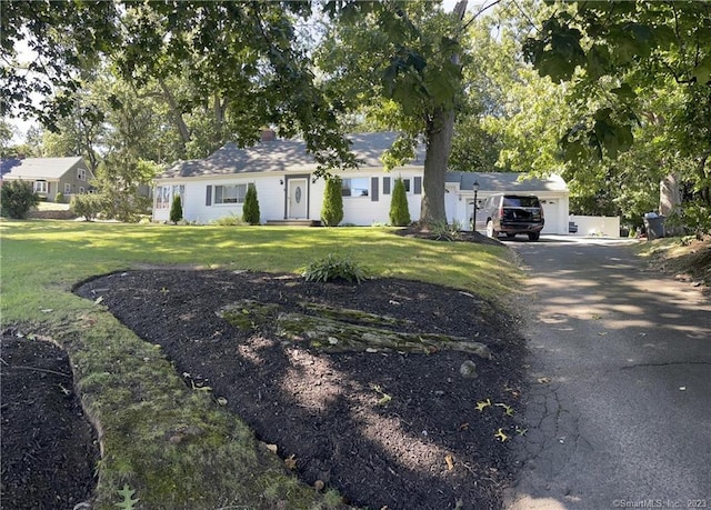 665 W Main St, West Haven, CT 06516 - ranch-style home featuring a front yard and asphalt driveway