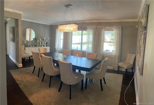 665 W Main St, West Haven, CT 06516 - dining room featuring a chandelier, ornamental molding, baseboards, and wood finished floors