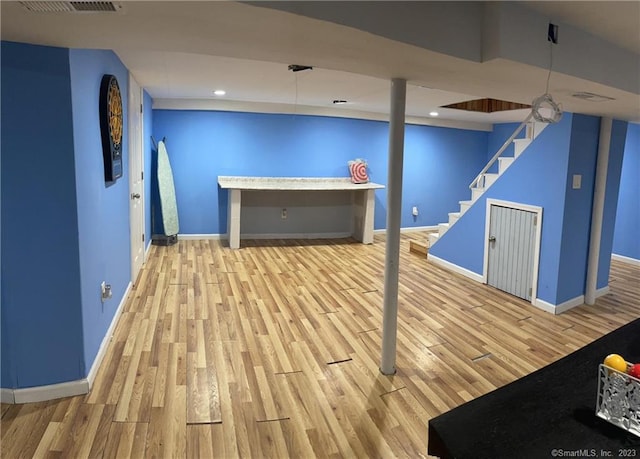 665 W Main St, West Haven, CT 06516 - finished below grade area with wood finished floors, baseboards, stairs, and recessed lighting