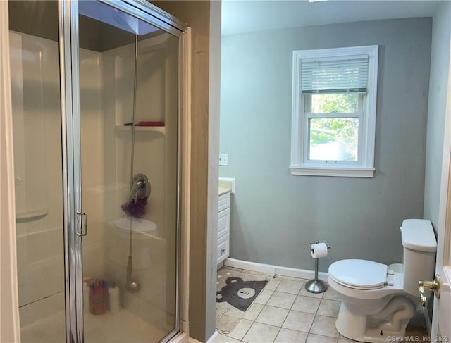 665 W Main St, West Haven, CT 06516 - bathroom featuring toilet, a shower stall, tile patterned floors, vanity, and baseboards