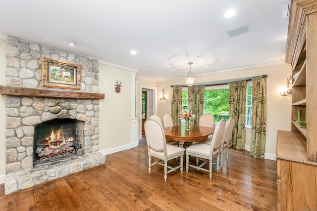 37 Salisbury Rd, Darien, CT 06820 - dining room with crown molding, baseboards, wood finished floors, a stone fireplace, and recessed lighting