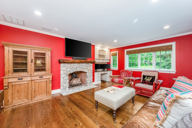 37 Salisbury Rd, Darien, CT 06820 - living area featuring ornamental molding, wood finished floors, recessed lighting, a stone fireplace, and baseboards