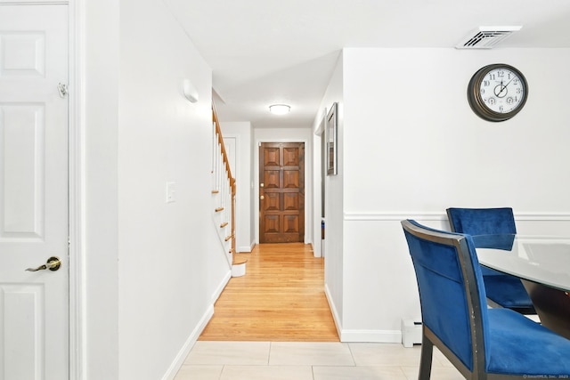 5 Crabapple Rd, Windsor, CT 06095 - hall featuring baseboard heating, light tile patterned floors, stairs, and baseboards