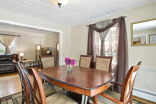 5 Crabapple Rd, Windsor, CT 06095 - dining area with a baseboard heating unit and a textured ceiling