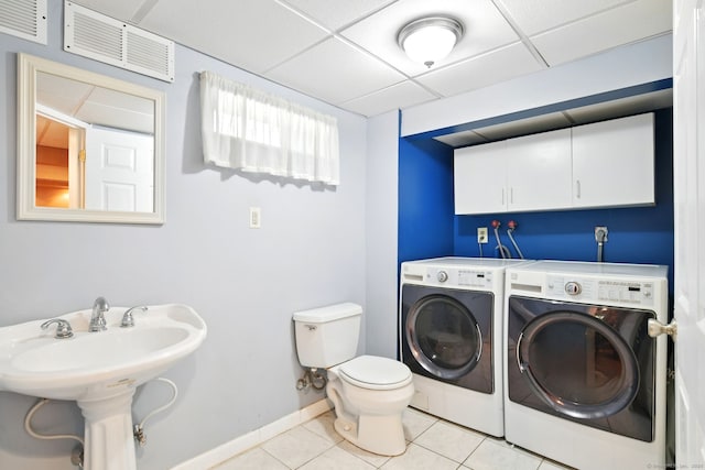 5 Crabapple Rd, Windsor, CT 06095 - laundry room featuring washing machine and clothes dryer, light tile patterned floors, and baseboards