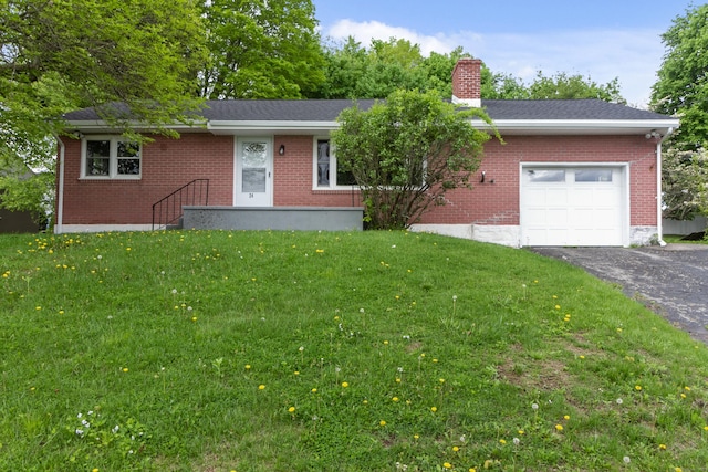 24 Manning St, New Fairfield, CT 06812 - ranch-style home with an attached garage, asphalt driveway, brick siding, a front yard, and a chimney