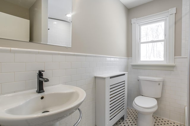 24 Manning St, New Fairfield, CT 06812 - bathroom featuring a sink, tile walls, toilet, and a wainscoted wall