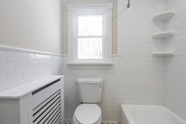 24 Manning St, New Fairfield, CT 06812 - bathroom with a tub, tile walls, toilet, a wainscoted wall, and a shower