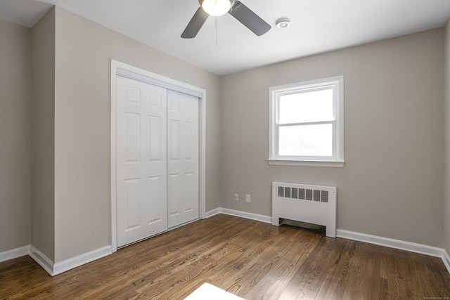 24 Manning St, New Fairfield, CT 06812 - unfurnished bedroom with radiator heating unit, wood finished floors, a closet, and baseboards