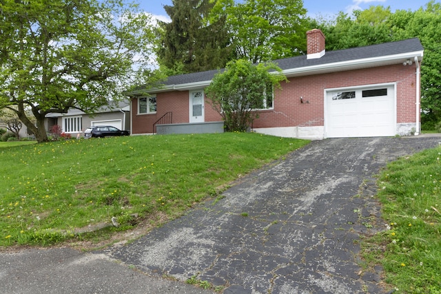 24 Manning St, New Fairfield, CT 06812 - ranch-style home with an attached garage, brick siding, a chimney, and a front lawn