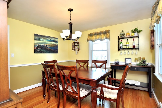 89 Bigelow St, Manchester, CT 06040 - dining room featuring a chandelier, wood finished floors, and baseboards