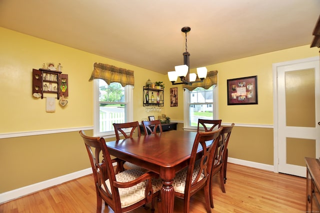89 Bigelow St, Manchester, CT 06040 - dining area with a chandelier, plenty of natural light, light wood-style flooring, and baseboards