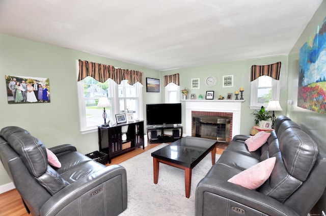 89 Bigelow St, Manchester, CT 06040 - living room featuring wood finished floors and a brick fireplace