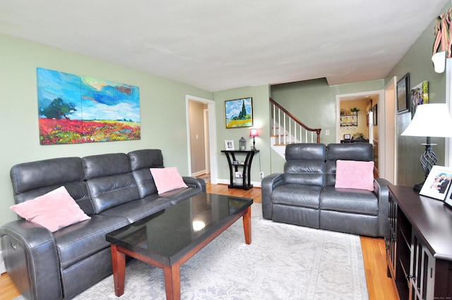 89 Bigelow St, Manchester, CT 06040 - living room featuring wood finished floors, stairway, and baseboards