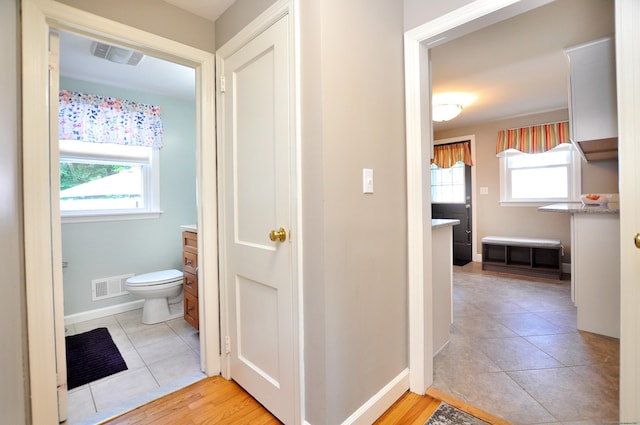89 Bigelow St, Manchester, CT 06040 - bathroom with plenty of natural light, toilet, tile patterned flooring, and baseboards
