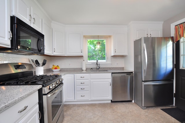89 Bigelow St, Manchester, CT 06040 - kitchen with appliances with stainless steel finishes, a sink, and white cabinetry