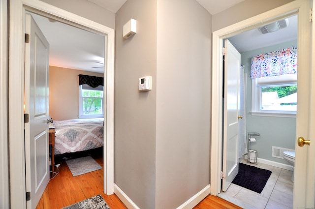 89 Bigelow St, Manchester, CT 06040 - bathroom featuring healthy amount of natural light, toilet, baseboards, and wood finished floors