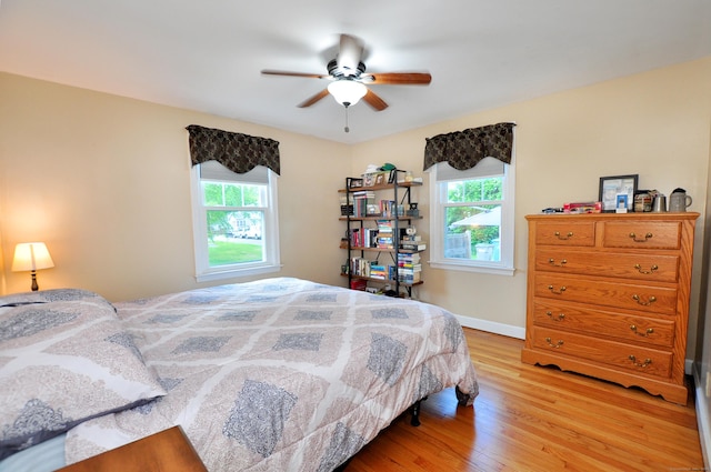 89 Bigelow St, Manchester, CT 06040 - bedroom featuring multiple windows, light wood-style floors, baseboards, and a ceiling fan