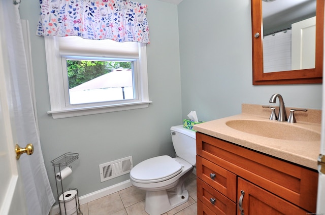 89 Bigelow St, Manchester, CT 06040 - full bath with vanity, toilet, tile patterned floors, and baseboards