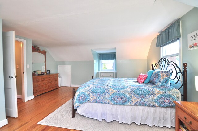89 Bigelow St, Manchester, CT 06040 - bedroom featuring lofted ceiling, wood finished floors, and baseboards