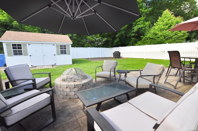 89 Bigelow St, Manchester, CT 06040 - view of patio featuring a fire pit, an outbuilding, area for grilling, and outdoor dining area