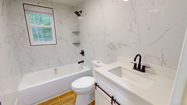 77 Hemlock St, Manchester, CT 06040 - full bath featuring toilet, vanity, tile walls, bathing tub / shower combination, and wood finished floors