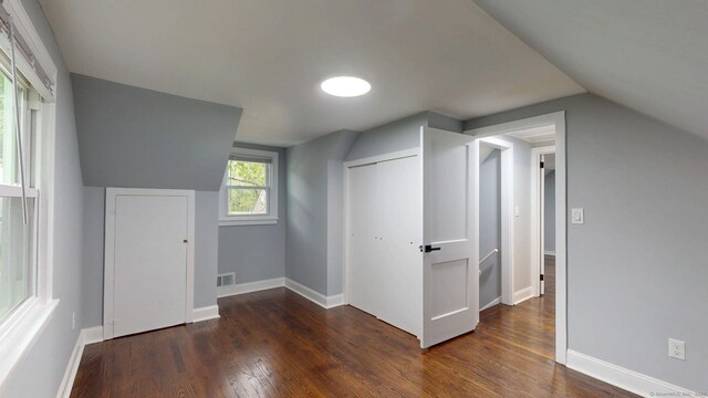 77 Hemlock St, Manchester, CT 06040 - additional living space with dark wood finished floors, baseboards, and lofted ceiling
