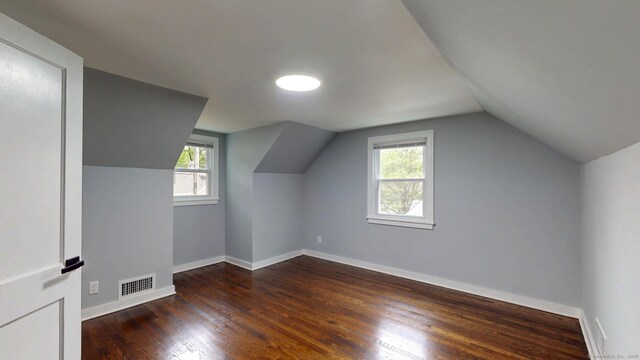 77 Hemlock St, Manchester, CT 06040 - bonus room featuring plenty of natural light, wood finished floors, lofted ceiling, and baseboards