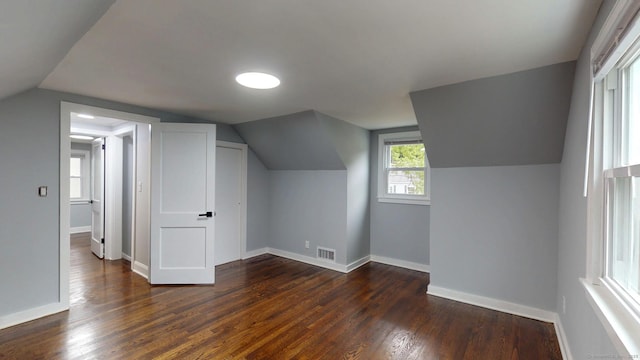 77 Hemlock St, Manchester, CT 06040 - additional living space featuring vaulted ceiling, dark wood-type flooring, and baseboards