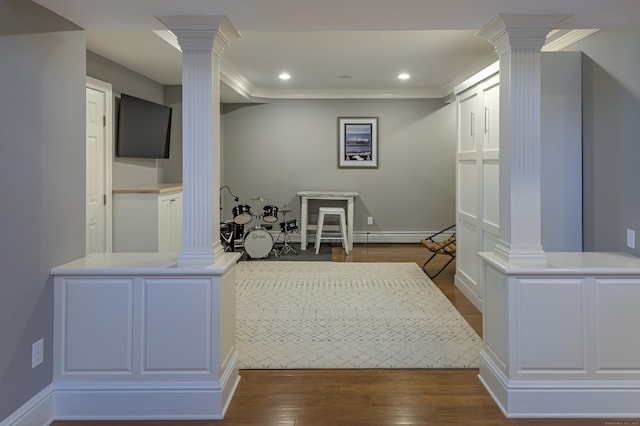 68 Topstone Rd, Ridgefield, CT 06877 - hallway with decorative columns, crown molding, dark wood-style floors, recessed lighting, and baseboards